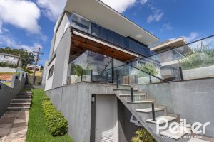 Casa em Condomínio à venda com 303m², 3 dormitórios, 3 suítes, 4 vagas, no bairro Alphaville em PORTO ALEGRE