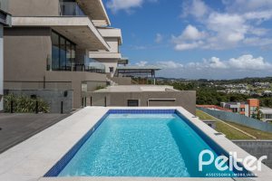 Casa em Condomínio à venda com 303m², 3 dormitórios, 3 suítes, 4 vagas, no bairro Alphaville em PORTO ALEGRE