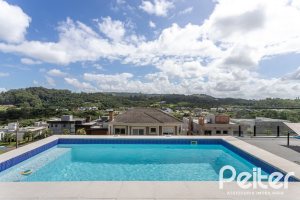 Casa em Condomínio à venda com 303m², 3 dormitórios, 3 suítes, 4 vagas, no bairro Alphaville em PORTO ALEGRE