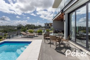 Casa em Condomínio à venda com 303m², 3 dormitórios, 3 suítes, 4 vagas, no bairro Alphaville em PORTO ALEGRE