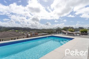 Casa em Condomínio à venda com 303m², 3 dormitórios, 3 suítes, 4 vagas, no bairro Alphaville em PORTO ALEGRE