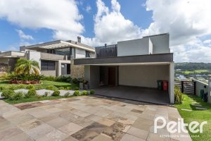 Casa em Condomínio à venda com 303m², 3 dormitórios, 3 suítes, 4 vagas, no bairro Alphaville em PORTO ALEGRE