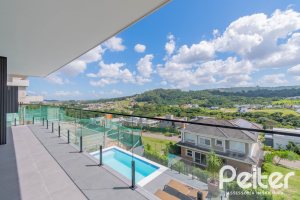Casa em Condomínio à venda com 303m², 3 dormitórios, 3 suítes, 4 vagas, no bairro Alphaville em PORTO ALEGRE