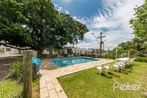 Casa em Condomínio à venda com 250m², 3 dormitórios, 3 suítes, 3 vagas, no bairro Hipica em PORTO ALEGRE