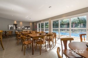 Casa em Condomínio à venda com 162m², 4 dormitórios, 2 suítes, 2 vagas, no bairro Vila Nova em PORTO ALEGRE