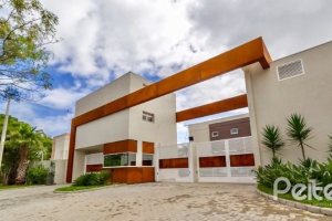 Casa em Condomínio à venda com 162m², 4 dormitórios, 2 suítes, 2 vagas, no bairro Vila Nova em PORTO ALEGRE