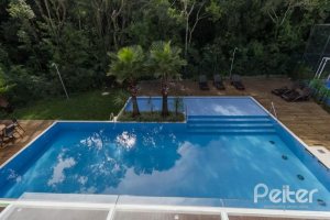 Casa em Condomínio à venda com 162m², 4 dormitórios, 2 suítes, 2 vagas, no bairro Vila Nova em PORTO ALEGRE