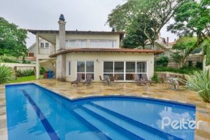 Casa em Condomínio à venda com 397m², 4 dormitórios, 4 suítes, 3 vagas, no bairro Vila Conceicao em PORTO ALEGRE