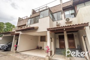 Casa em Condomínio à venda com 290m², 3 dormitórios, 1 suíte, 2 vagas, no bairro Jardim Isabel em Porto Alegre