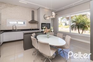 Casa em Condomínio à venda com 240m², 3 dormitórios, 3 suítes, 2 vagas, no bairro Alphaville em PORTO ALEGRE
