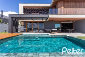 Casa em Condomínio à venda com 608m², 5 dormitórios, 5 suítes, 3 vagas, no bairro Terra Ville em PORTO ALEGRE