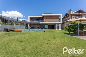 Casa em Condomínio à venda com 608m², 5 dormitórios, 5 suítes, 3 vagas, no bairro Terra Ville em PORTO ALEGRE