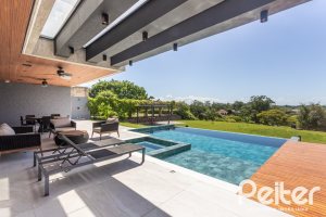 Casa em Condomínio à venda com 608m², 5 dormitórios, 5 suítes, 3 vagas, no bairro Terra Ville em PORTO ALEGRE