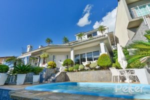 Casa à venda com 399m², 3 dormitórios, 3 suítes, 4 vagas, no bairro Nonoai em Porto Alegre