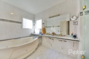 Casa à venda com 399m², 3 dormitórios, 3 suítes, 4 vagas, no bairro Nonoai em Porto Alegre