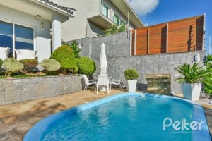 Casa à venda com 399m², 3 dormitórios, 3 suítes, 4 vagas, no bairro Nonoai em Porto Alegre