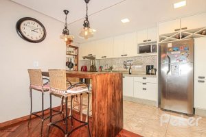 Casa em Condomínio à venda com 191m², 4 dormitórios, 2 suítes, 2 vagas, no bairro Jardim Isabel em Porto Alegre