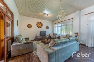 Casa em Condomínio à venda com 400m², 3 dormitórios, 1 suíte, 6 vagas, no bairro Cavalhada em PORTO ALEGRE