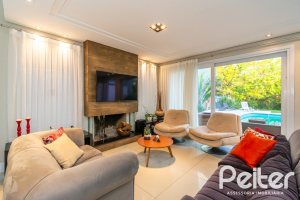 Casa em Condomínio à venda com 220m², 4 dormitórios, 4 suítes, 2 vagas, no bairro Terra Ville em PORTO ALEGRE