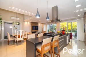 Casa em Condomínio à venda com 220m², 4 dormitórios, 4 suítes, 2 vagas, no bairro Terra Ville em PORTO ALEGRE