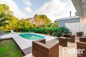 Casa em Condomínio à venda com 220m², 4 dormitórios, 4 suítes, 2 vagas, no bairro Terra Ville em PORTO ALEGRE