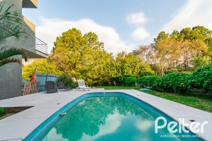 Casa em Condomínio à venda com 220m², 4 dormitórios, 4 suítes, 2 vagas, no bairro Terra Ville em PORTO ALEGRE