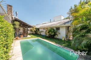 Casa à venda com 250m², 3 dormitórios, 1 suíte, 4 vagas, no bairro Jardim Isabel em Porto Alegre