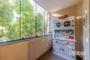 Casa em Condomínio à venda com 201m², 3 dormitórios, 1 suíte, 2 vagas, no bairro Tristeza em Porto Alegre