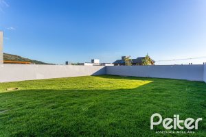 Casa em Condomínio à venda com 293m², 4 dormitórios, 4 suítes, 2 vagas, no bairro Alphaville em PORTO ALEGRE