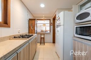 Casa em Condomínio à venda com 219m², 3 dormitórios, 1 suíte, 3 vagas, no bairro Tristeza em Porto Alegre