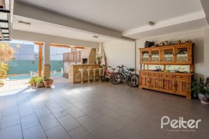 Casa em Condomínio à venda com 219m², 3 dormitórios, 1 suíte, 3 vagas, no bairro Tristeza em Porto Alegre