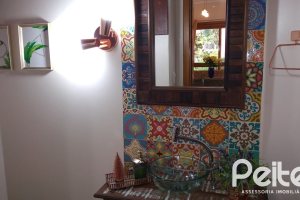 Casa em Condomínio à venda com 148m², 3 dormitórios, 1 suíte, 2 vagas, no bairro Guarujá em Porto Alegre