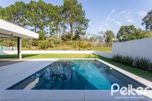 Casa em Condomínio à venda com 434m², 4 dormitórios, 4 suítes, 6 vagas, no bairro Terra Ville em PORTO ALEGRE