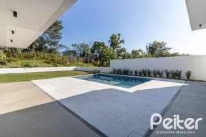 Casa em Condomínio à venda com 434m², 4 dormitórios, 4 suítes, 6 vagas, no bairro Terra Ville em PORTO ALEGRE