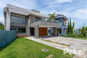 Casa em Condomínio à venda com 380m², 4 dormitórios, 4 suítes, 3 vagas, no bairro Alphaville em PORTO ALEGRE