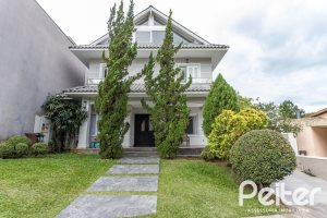 Casa em Condomínio à venda com 242m², 3 dormitórios, 3 suítes, 4 vagas, no bairro Mountain Ville em PORTO ALEGRE