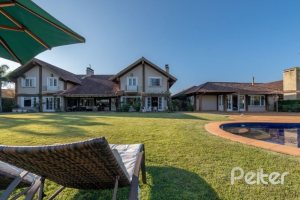 Casa em Condomínio à venda com 817m², 5 dormitórios, 5 suítes, 8 vagas, no bairro Terra Ville em PORTO ALEGRE