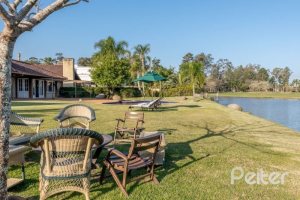 Casa em Condomínio à venda com 817m², 5 dormitórios, 5 suítes, 8 vagas, no bairro Terra Ville em PORTO ALEGRE