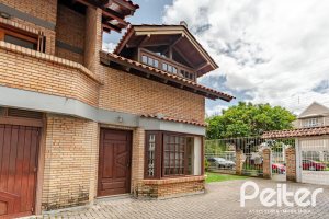 Casa em Condomínio à venda com 206m², 3 dormitórios, 1 suíte, 2 vagas, no bairro Tristeza em Porto Alegre