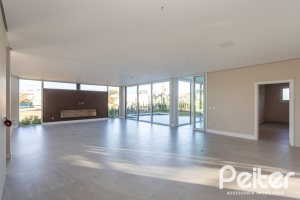 Casa em Condomínio à venda com 400m², 3 dormitórios, 3 suítes, 4 vagas, no bairro Alphaville em PORTO ALEGRE