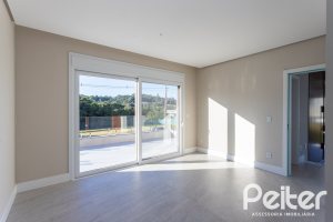 Casa em Condomínio à venda com 400m², 3 dormitórios, 3 suítes, 4 vagas, no bairro Alphaville em PORTO ALEGRE