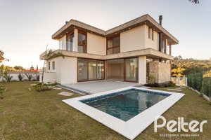Casa em Condomínio à venda com 400m², 3 dormitórios, 3 suítes, 4 vagas, no bairro Alphaville em PORTO ALEGRE
