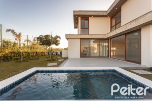 Casa em Condomínio à venda com 400m², 3 dormitórios, 3 suítes, 4 vagas, no bairro Alphaville em PORTO ALEGRE