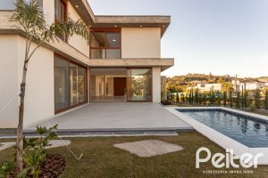 Casa em Condomínio à venda com 400m², 3 dormitórios, 3 suítes, 4 vagas, no bairro Alphaville em PORTO ALEGRE
