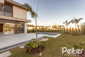 Casa em Condomínio à venda com 400m², 3 dormitórios, 3 suítes, 4 vagas, no bairro Alphaville em PORTO ALEGRE