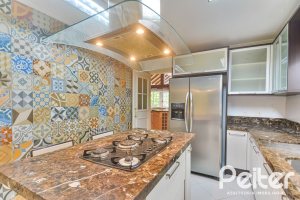 Casa em Condomínio à venda com 358m², 3 dormitórios, 3 suítes, 4 vagas, no bairro Terra Ville em PORTO ALEGRE