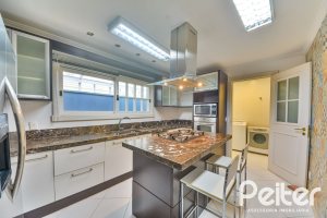 Casa em Condomínio à venda com 358m², 3 dormitórios, 3 suítes, 4 vagas, no bairro Terra Ville em PORTO ALEGRE