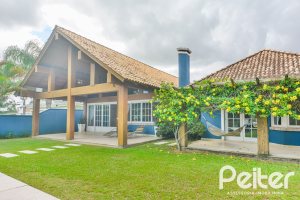Casa em Condomínio à venda com 358m², 3 dormitórios, 3 suítes, 4 vagas, no bairro Terra Ville em PORTO ALEGRE
