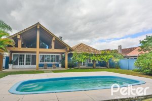 Casa em Condomínio à venda com 358m², 3 dormitórios, 3 suítes, 4 vagas, no bairro Terra Ville em PORTO ALEGRE