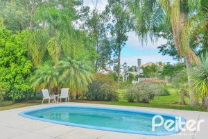Casa em Condomínio à venda com 358m², 3 dormitórios, 3 suítes, 4 vagas, no bairro Terra Ville em PORTO ALEGRE